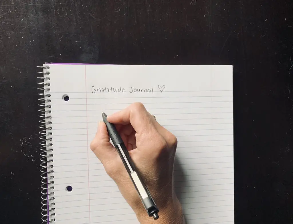 Gratitude journal. Blank paper and pen. Self care