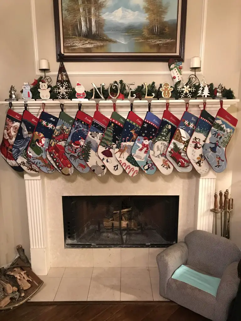 Family stockings hung on a fireplace.